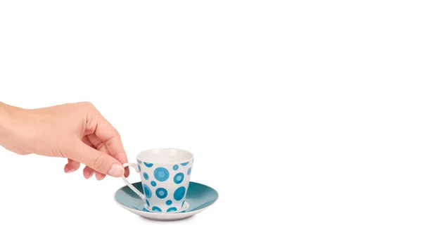 Color cup and saucer in hand isolated on white background. copy space, template — Stock Photo, Image