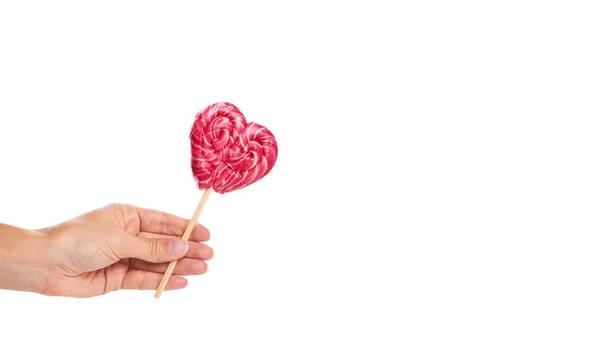 Hand made candy heart shape in hand isolated on white background. copy space, template — Stock Photo, Image