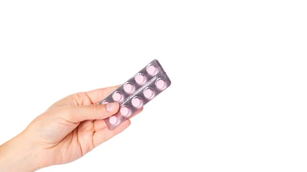 Medicinsk tabletter i blister i hand isolerade på vit bakgrund. Kopiera utrymme, mall — Stockfoto