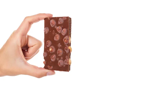 Schokoladentafel mit Nüssen in der Hand, isoliert auf weißem Hintergrund. Kopierraum, Vorlage — Stockfoto