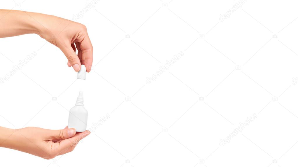 Medicine Dropper Bottle in hand Isolated on White Background. copy space, template