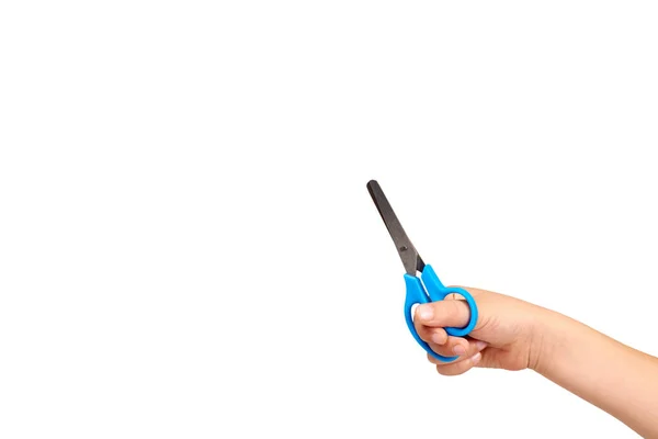 Children hand with blue little scissors, kids educational work. — Stock Photo, Image