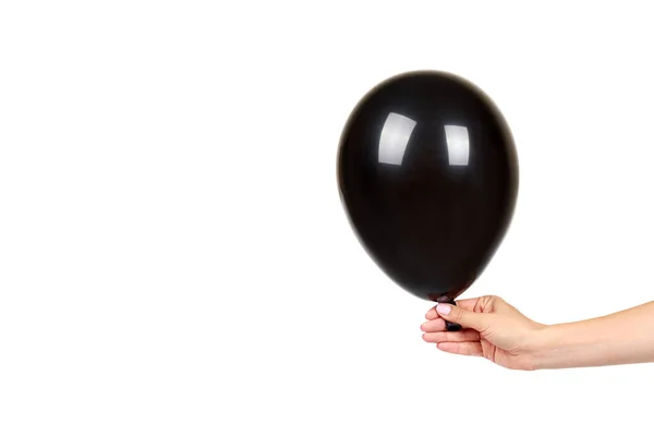 Hand mit schwarzem Luftballon, Partydekoration, Hochglanzball. — Stockfoto
