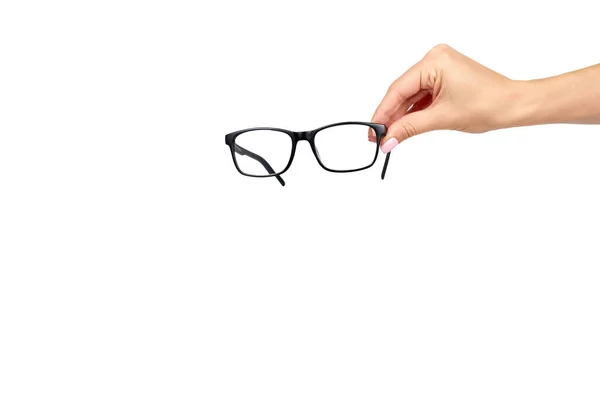 Hand mit schwarzer Brille, Augenoptik-Korrekturwerkzeug. — Stockfoto