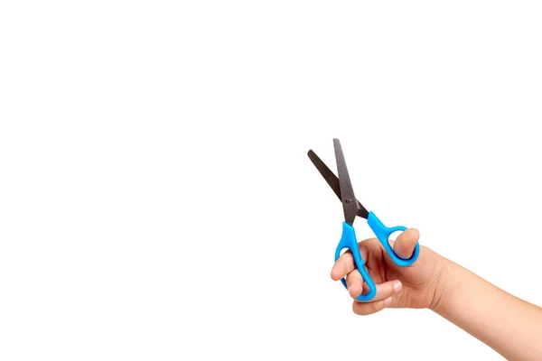 Children hand with blue little scissors, kids educational work. — Stock Photo, Image
