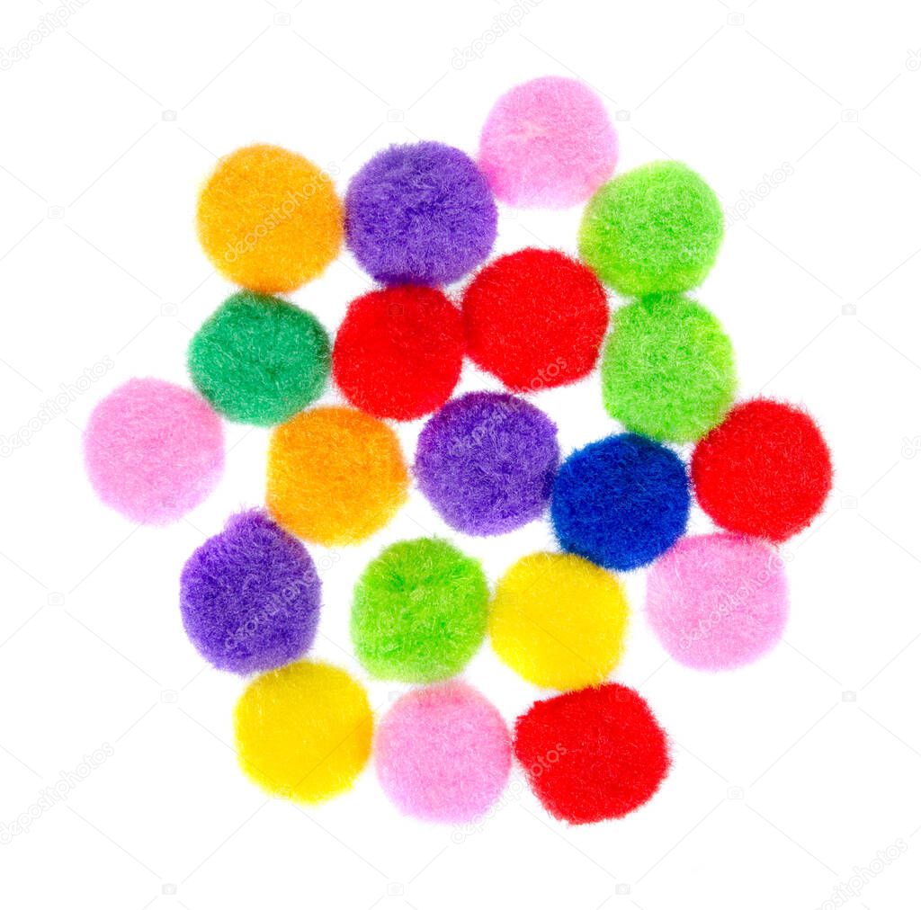 Colored pom pom, party and sewing decoration. Isolated on white.