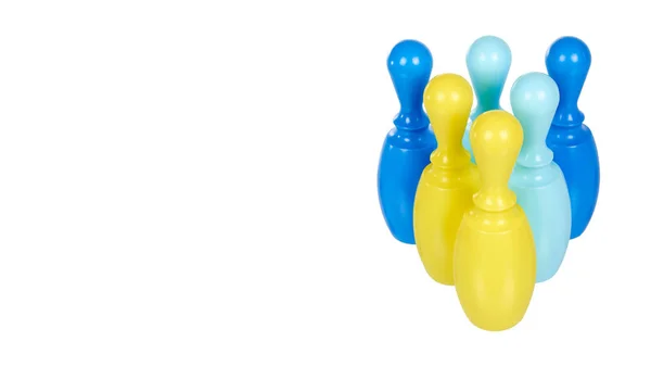 Plastic colored skittles for bowling game. Kids toy. — Stock Photo, Image