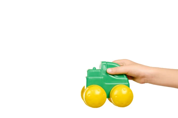 Plastic green toy car with big yellow wheels. — Stock Photo, Image