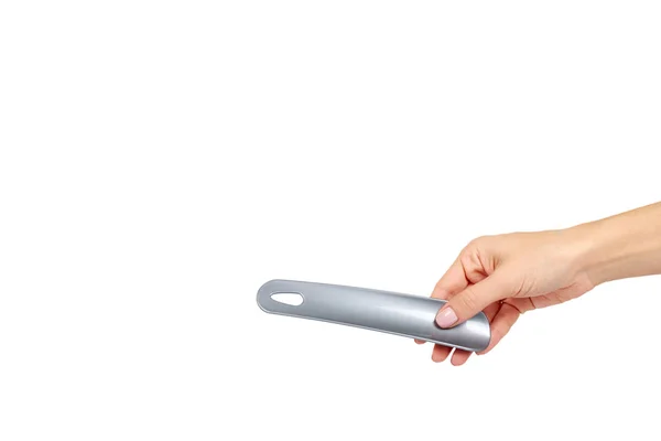 Plastic gray shoe spoon. Shoehorn foot accessory. — Stock Photo, Image