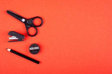 School supply on red background composition. Flat lay.