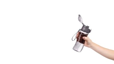 Hand with gray sport water bottle, drinking equipment. Isolated on white background. Copy space, template.