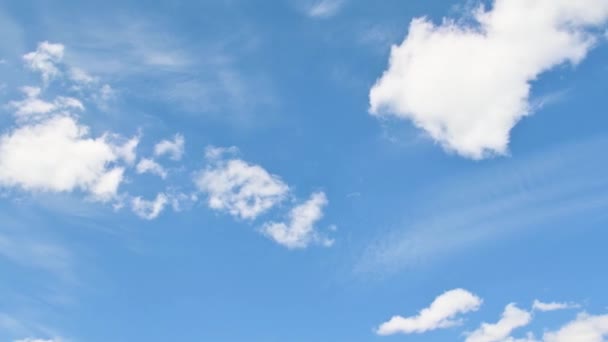 White fluffy clouds time lapse, blue sky background. — Stock Video