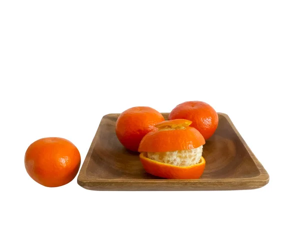 Tangerines in wooden plate — Stock Photo, Image