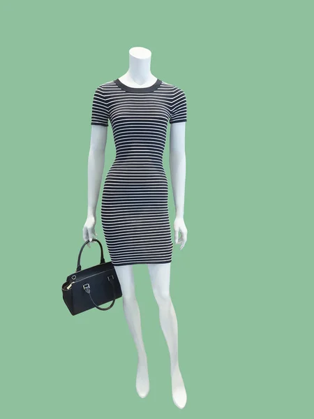 Female mannequin wearing black striped dress. — Stock Photo, Image