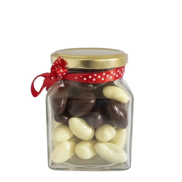 Glass jar with chocolate bonbons. — Stock Photo, Image