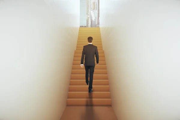 Back view of young businessman in suit climbing abstract narrow ladder leading to bright city. Success concept. 3D Rendering — Stock Photo, Image