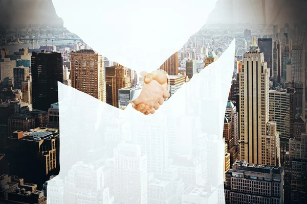Businesspeople shaking hands on city background. Partnership concept. Double exposure — Stock Photo, Image