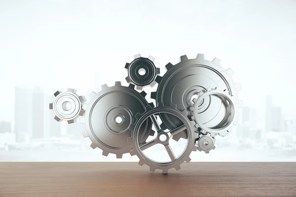 Wooden surface with abstract gear mechanism on city background. Teamwork concept. 3D Rendering — Stock Photo, Image