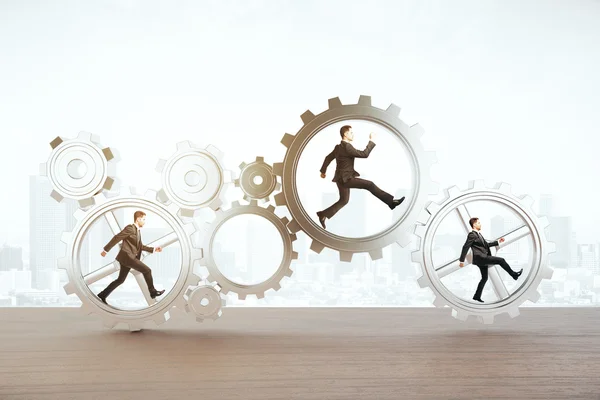 Businessmen running inside abstract cogwheels on light background. Teamwork concept. 3D Rendering — Stock Photo, Image