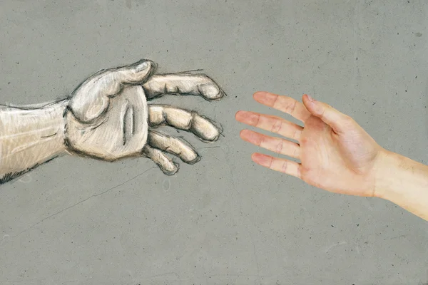Настоящие и нарисованные руки — стоковое фото
