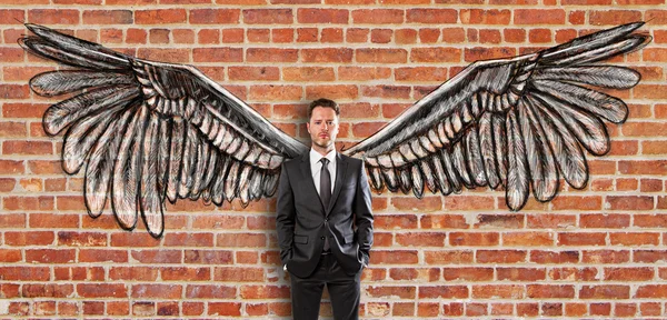 Young man with wings — Stock fotografie