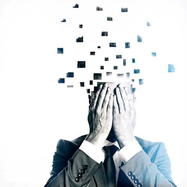 Businessman with broken into pieces head on light background. Overworked concept — Stockfoto