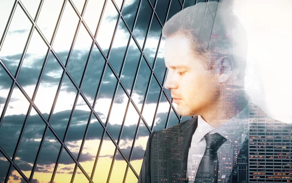 Sad pensive businessman behind iron wire mesh on sky background. Freedom concept — Stock fotografie