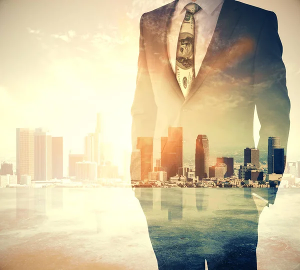 Businessman on city background — Stock Photo, Image