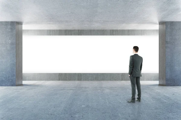 Businessman looking at billboard — Stock Photo, Image