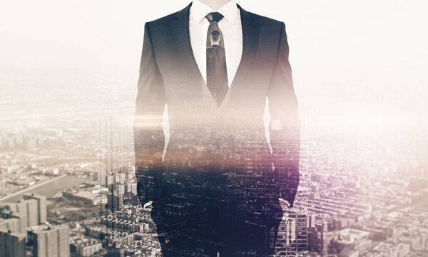 Businessperson in suit on city background. Double exposure. Employment concept