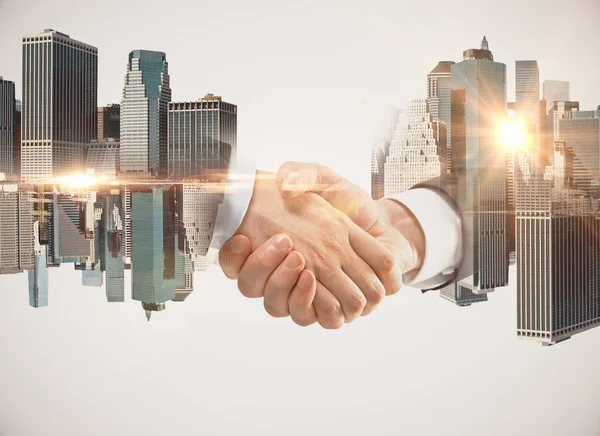 Men shaking hands on abstract city background. Double exposure. Teamwork concept — Stock Photo, Image