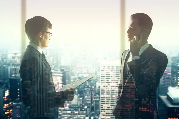 Two handsome businessmen on city background with sunlight. Teamwork concept. Double exposure — Stock Photo, Image