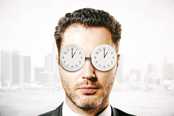 Businessman with abstract glasses clock — Stock Photo, Image