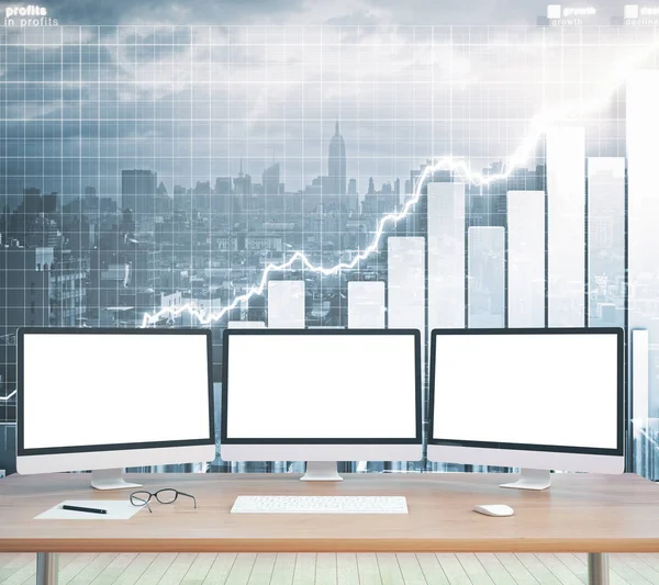 Empty white pc screens on wooden desktop with business charts and city in the background. Mock up, 3D Rendering. Finance concept