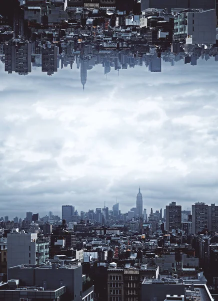 Abstract upside down city on stormy sky background. Risk concept. Copy space. — Stock Photo, Image