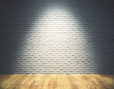 Empty brick wall with spotlight clipart