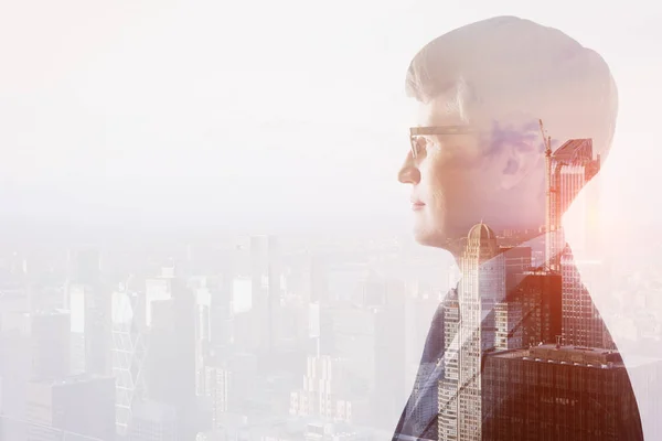 Side portrait of thoughtful handsome young man on abstract city background with copy space. Career concept. Double exposure — Stock Photo, Image