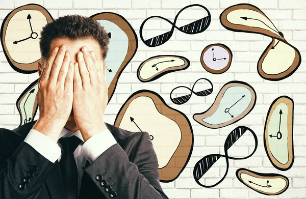 Stressad affärsman med ritade klockor — Stockfoto