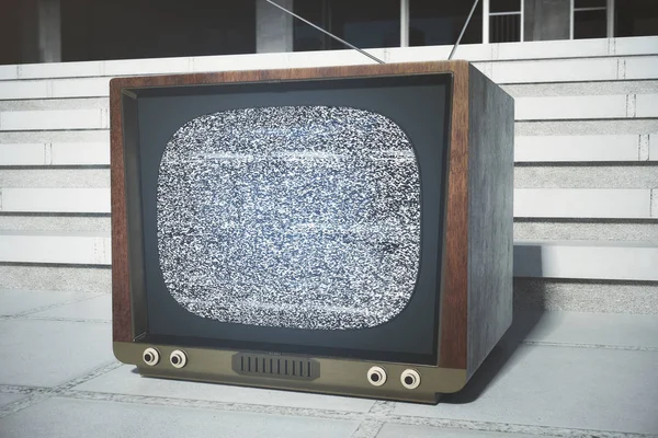 Obsolete TV next to concrete building — Stock Photo, Image