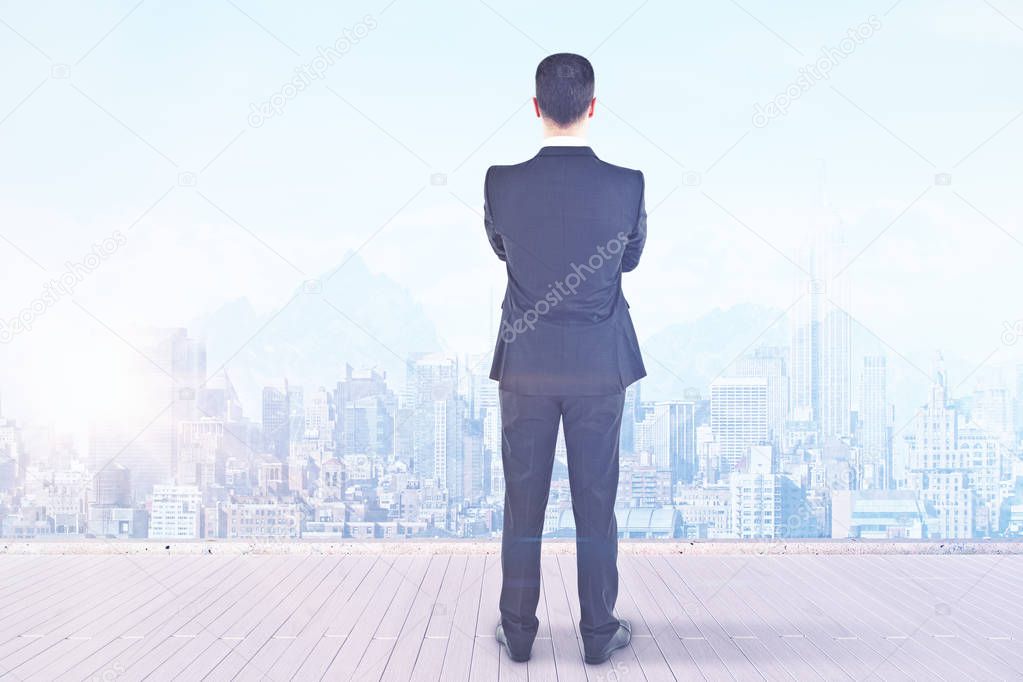 Businessman looking at city