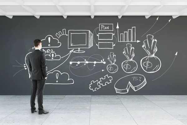 Rückansicht eines jungen Geschäftsmannes, der auf eine Wand mit einer Geschäftsskizze im Inneren blickt. Leistungskonzept. 3D-Darstellung — Stockfoto