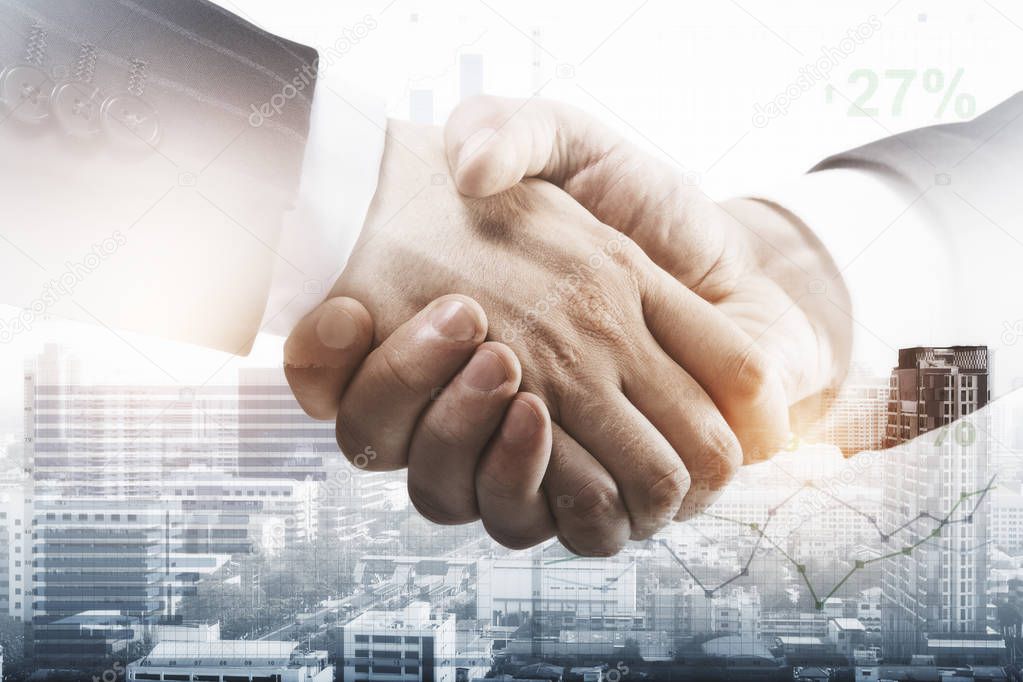 Side view of handshake on abstract city background with business/forex chart. Teamwork concept. Double exposure