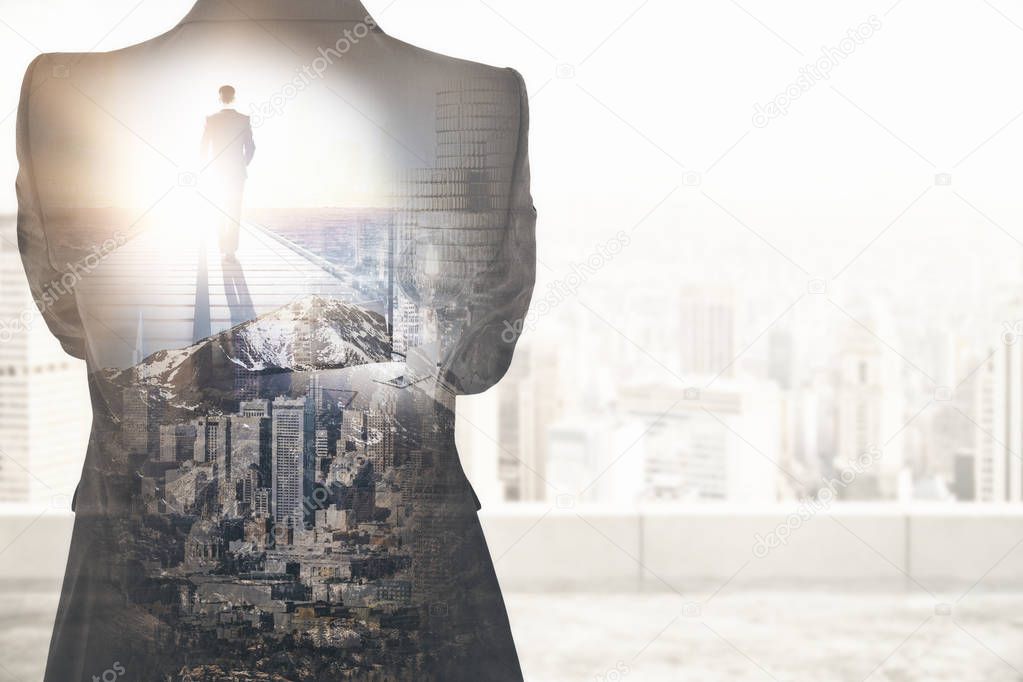 Back view of young businessman walking on pier on abstract city background with copy space. 