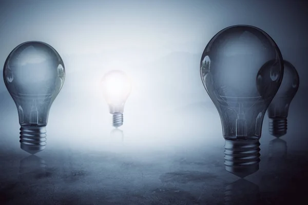 Glowing light bulbs on misty blurry gray background. Idea concept. 3D Rendering — Stock Photo, Image