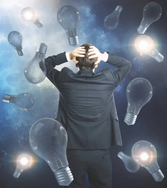 Worried man on lightbulb background — Stock Photo, Image