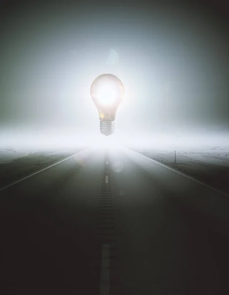 Abstract glowing levitating lamp in the middle of road. Enlightenment concept. 3D Rendering — Stock Photo, Image