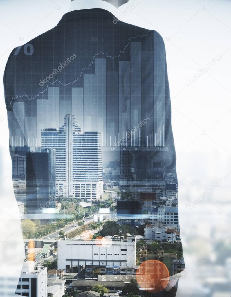 Unrecognizable businessman on abstract city background