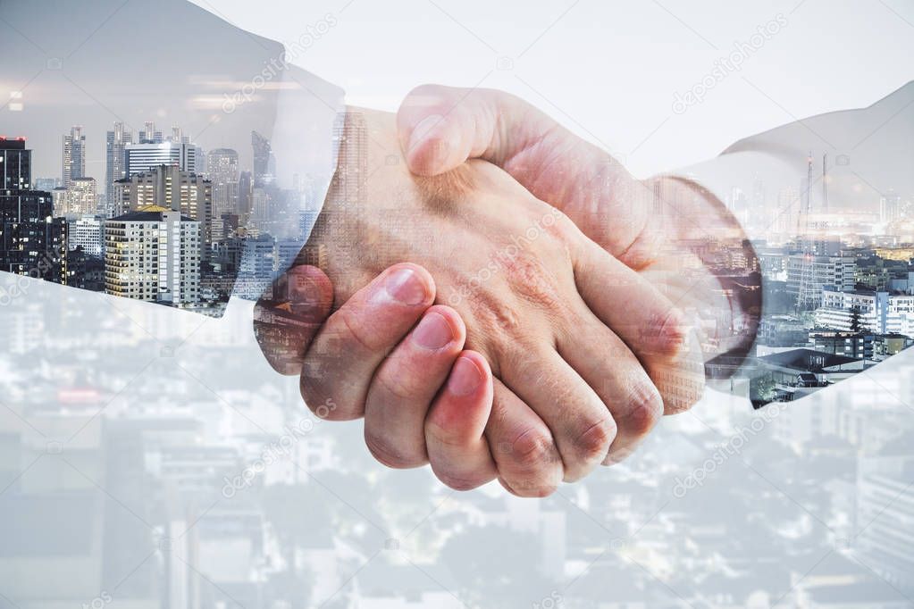 Side view and close up of professional handshake on abstract modern downtown city background. Deal concept. Double exposure 