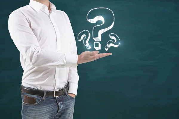 Man holding question marks — Stock Photo, Image