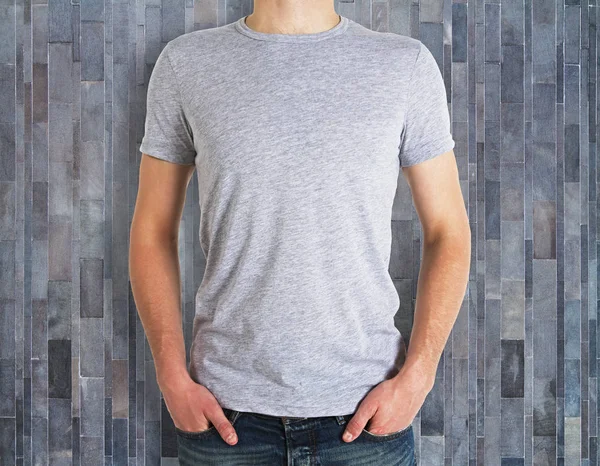 Man wearing clean shirt on wooden background — Stock Photo, Image